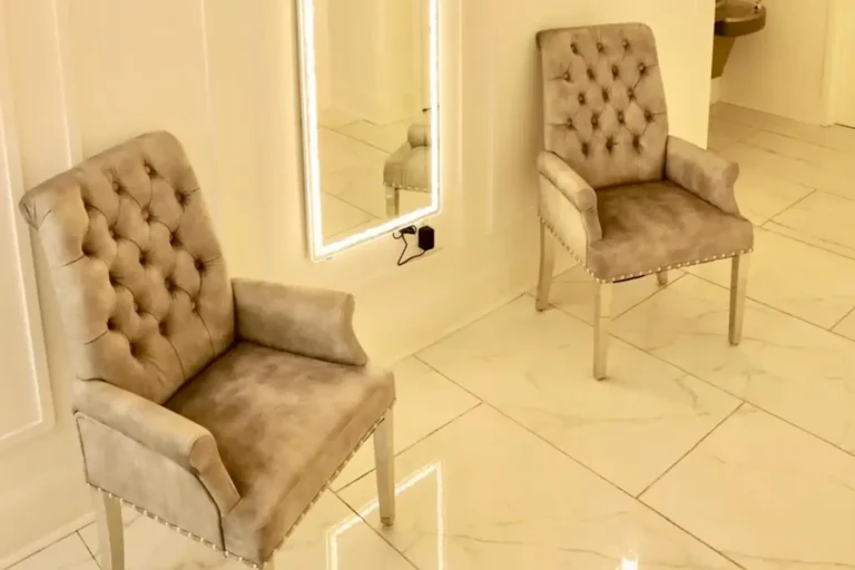 Spacious hall with banquet tables and chandelier lighting